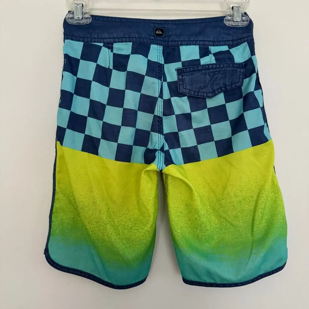 Quiksilver Board Shorts Featuring a Checkerboard Top and a Gradient Bottom